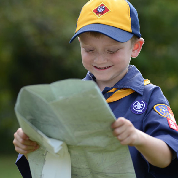 little boy looking at map